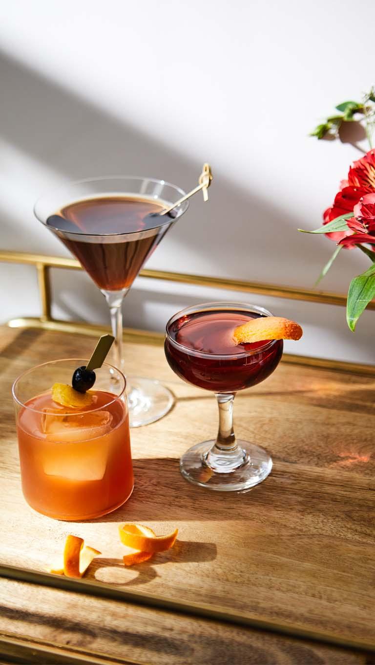 Light beaming into drinks of various size, shape, and colour.
