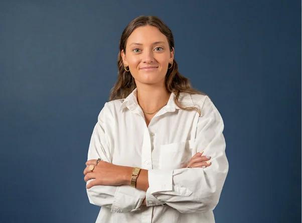 a woman standing with her arms crossed