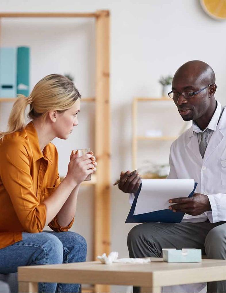 A Doctor informing a patient