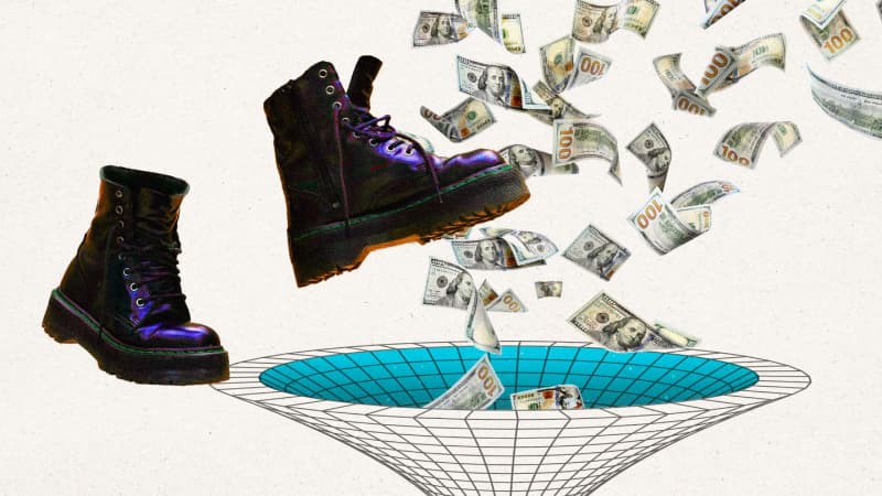 A pair of shoes are falling into a bowl of money