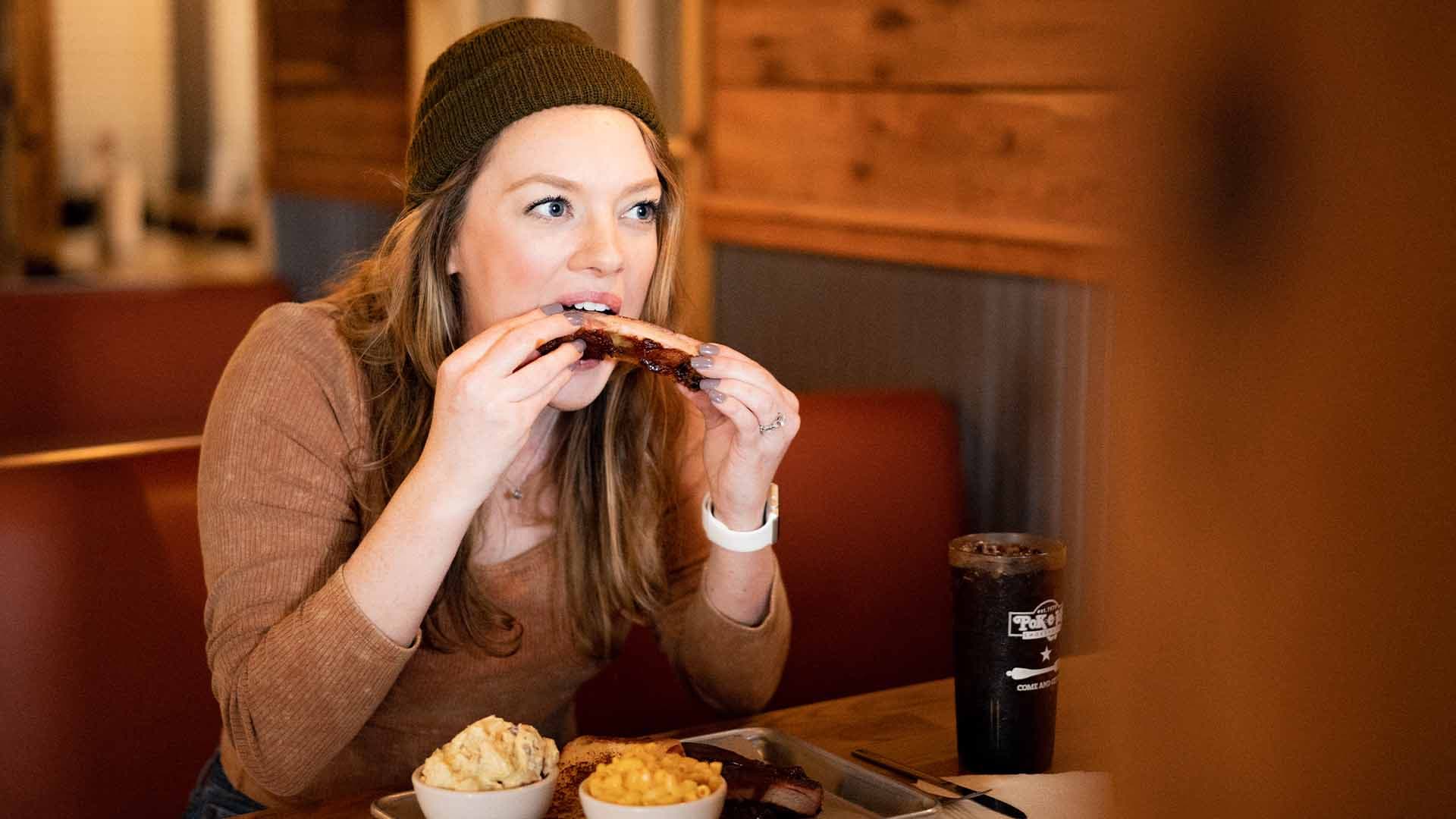 Woman eating ribs