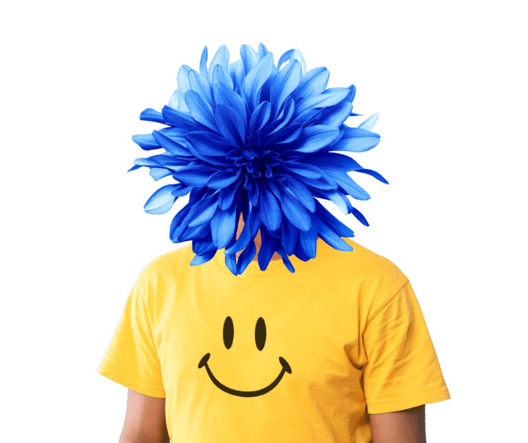 a person wearing a yellow smiley face shirt and his head is replaced with a large blue flower.